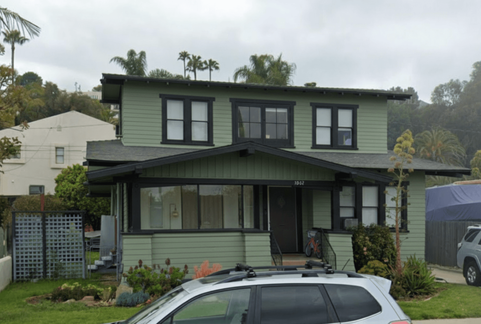Exterior after paint - sage green siding